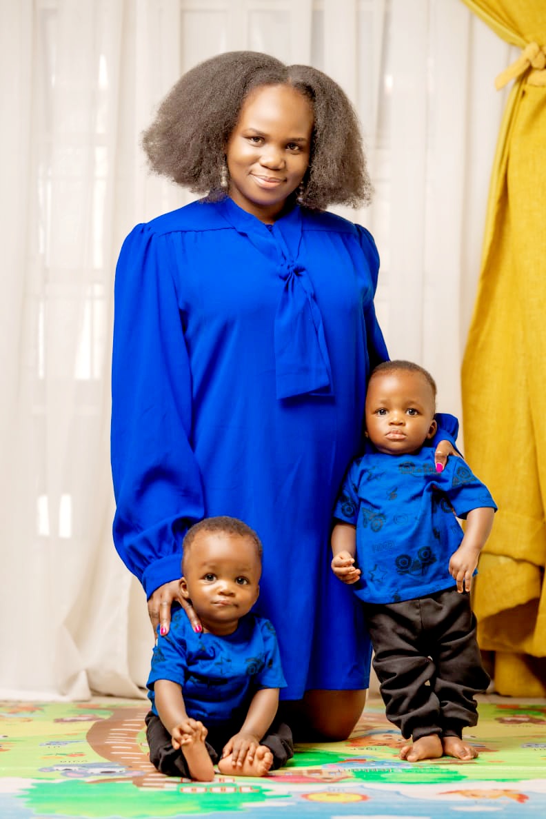 A mother holding her twin boys, reflecting on two years of twin motherhood, beautiful chaos, healing, and becoming.